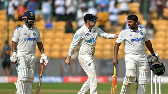 New Zealand captain Tom Latham shows sportsmanship by congratulating Sarfaraz Khan on his marathon knock